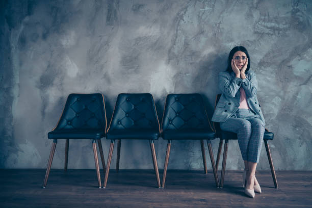 istock Her she nice stylish elegant executive manager marketer financier brunette lady waiting appointment meeting terrified fear at industrial loft style interior room work place station 1148002441