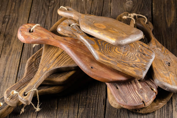 istock high detailed background texture kitchen chopping several many boards old vintage color of dark black with rifts and cracks, stripes one two three rings, wooden grain, abstract lie on the table 1148003080