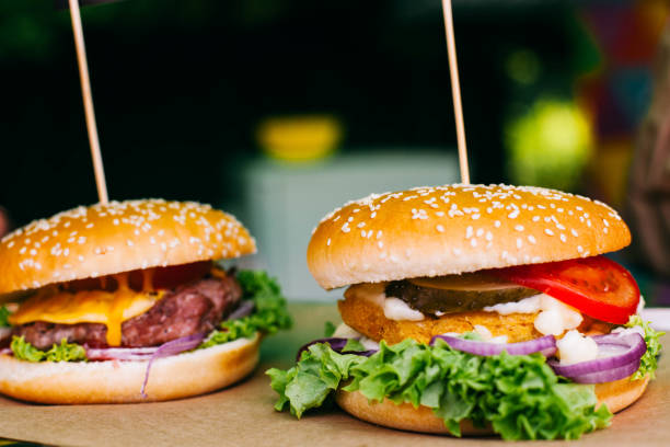istock Hamburgers with vegetables and salad 1148003237
