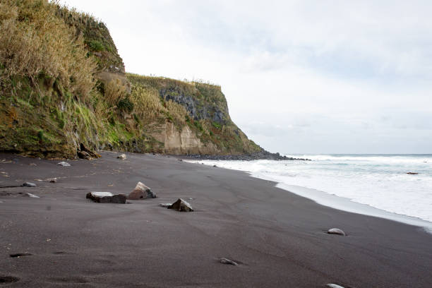 istock Black sand beach on a volcanic island. 1148003356