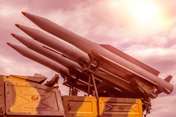 istock Nuclear missiles aimed up against the cloudy sky. 1148003945