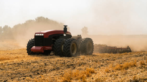 Autonomous tractor Autonomous tractor working in the field. Smart farming concept autonomous technology stock pictures, royalty-free photos & images