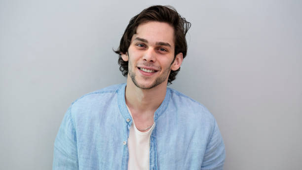 istock Portrait of handsome smiling young man 1148009223