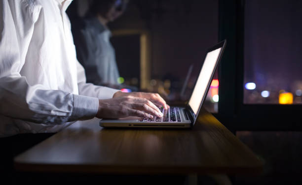 istock Businessman working with laptop at night 1148010239