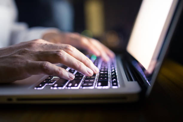 istock Businessman working with laptop at night 1148010274