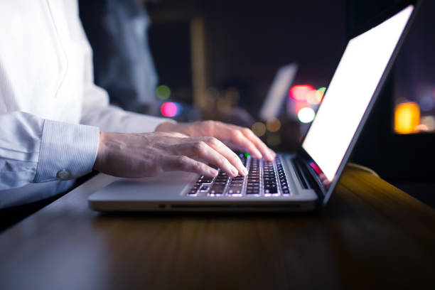 istock Businessman working with laptop at night 1148010277