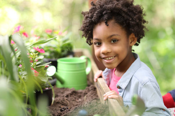 istock Cute little girl gardening outdoors in spring. 1148010700