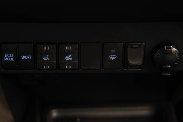istock The center console of the car with control buttons for heated seats, windshield wipers, eco mode, sport for choosing comfortable driving in a black interior. Auto service industry. 1148010911
