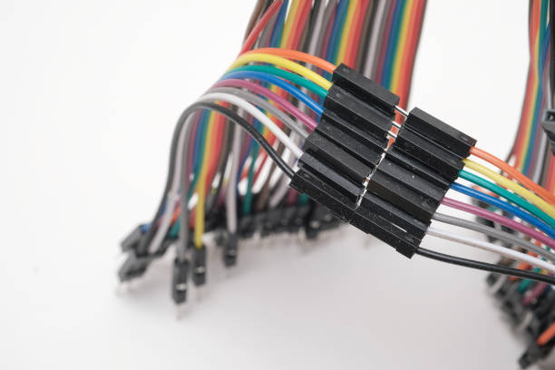 istock A metal robot and an electronic board 1148012510