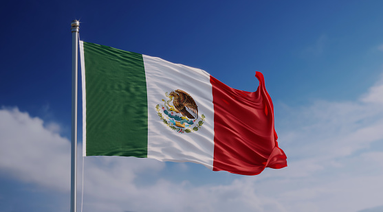 High quality 3d render of a Mexican flag waving with wind over blue sky.