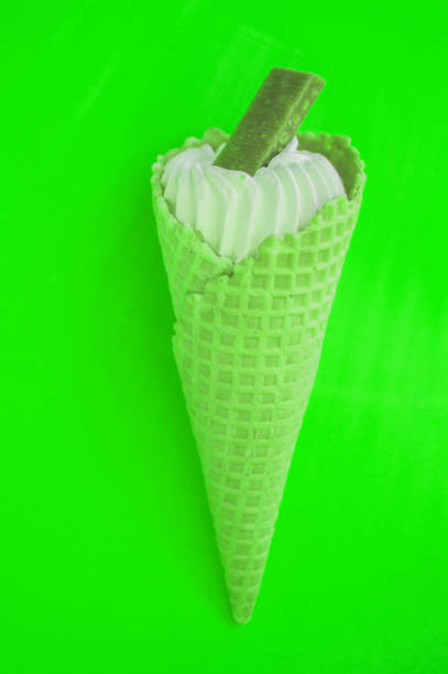 istock Ice cream CONE NEON COLORS pop art art Flatley, bright green background 1148013412