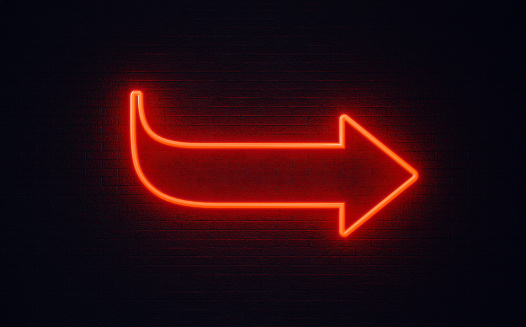 Red Arrow On Black Wall Stock Photo - Download Image Now Lighting, Arrow Symbol, Red - iStock