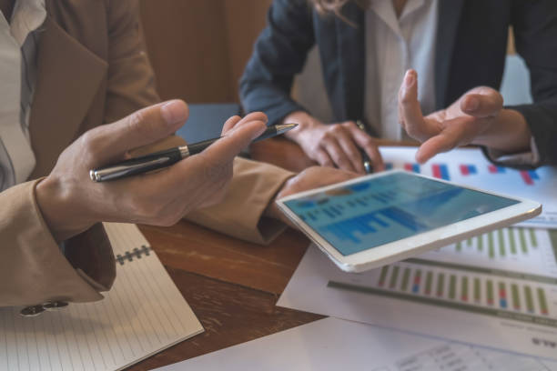 istock Business team brainstorming and discussing with financial data and report graph. Teamwork meeting working concept. 1148014621