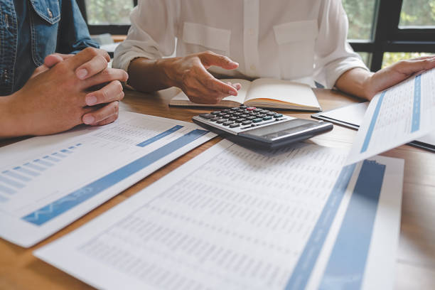 istock Business team brainstorming and discussing with financial data and report graph. Teamwork meeting working concept. 1148014630
