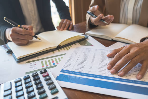 istock Business team brainstorming and discussing with financial data and report graph. Teamwork meeting working concept. 1148014957