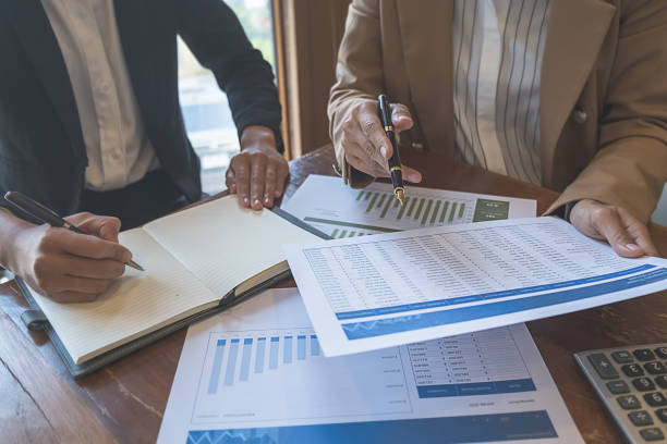 istock Business team brainstorming and discussing with financial data and report graph. Teamwork meeting working concept. 1148015052