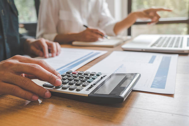 istock Business team brainstorming and discussing with financial data and report graph. Teamwork meeting working concept. 1148015079