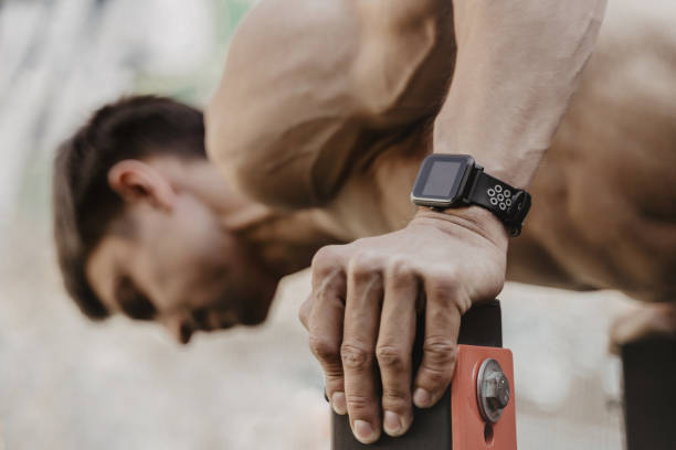 istock Closeup of athlete practicing calisthenics with smartwatch on his wrist. 1148016272