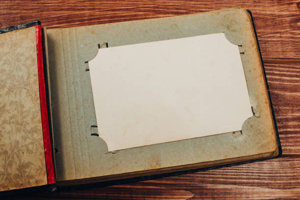 istock Stack old photos on table. Mock-up blank paper. Postcard rumpled and dirty vintage. Retro card 1148017518