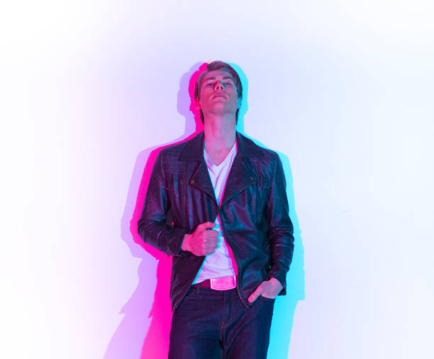 istock Handsome male model with color shadows 1148018541