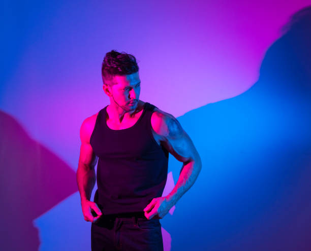 istock Handsome latino man in front of colorful wall 1148019338