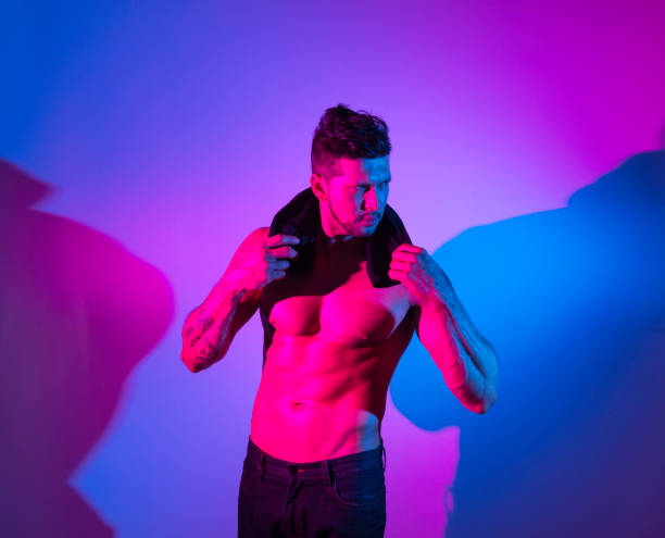 istock Handsome latino man in front of colorful wall 1148019880