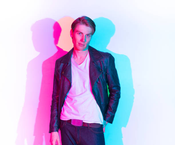 istock Handsome male model with color shadows 1148021258