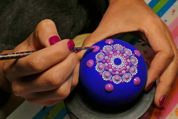 istock Painting of a stone with the Mandala technique 1148021344