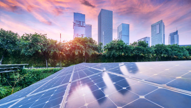 istock Ecological energy renewable solar panel plant with urban landscape landmarks in sunset 1148021779