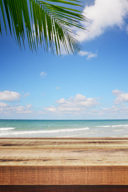 istock Beach background with palm tree and empty wooden, Summer. 1148022094