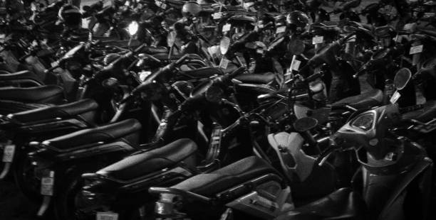 istock scooters parked in dense rows, beautiful night lighting, soft focus, background 1148022134