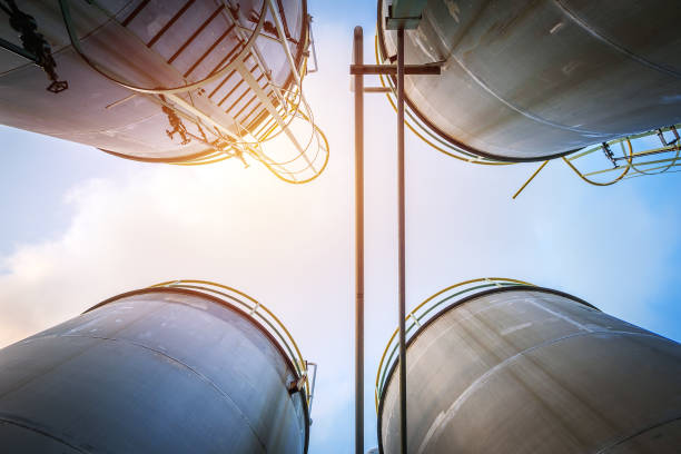 Storage tanks Stainless tanks and pipeline for liquid chemical industrial on sky background silo photos stock pictures, royalty-free photos & images