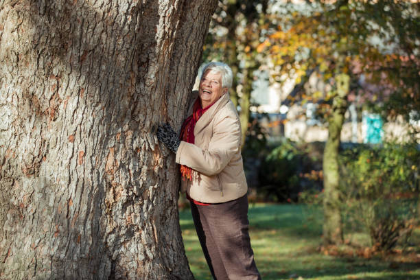 istock Senior Woman Having Autumn Fun in the Park 1148024095