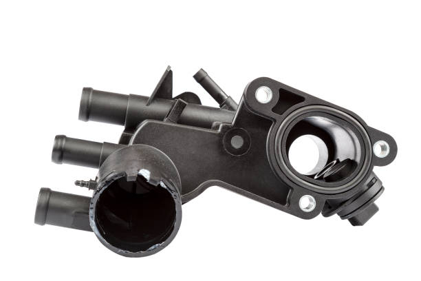 Thermostat housing and the engine temperature sensor of the car isolated on white background.