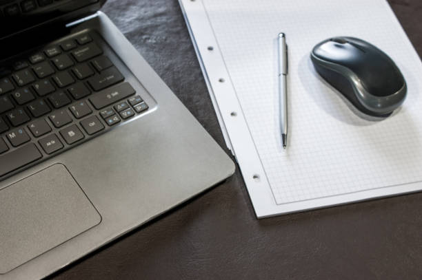 istock the laptop, the mouse, and the note pad 1148024658
