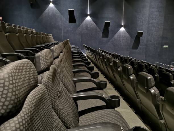 istock empty cinema auditorium with red seats 1148028032