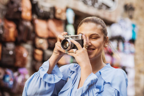 istock Young woman tsaking a picture 1148031155