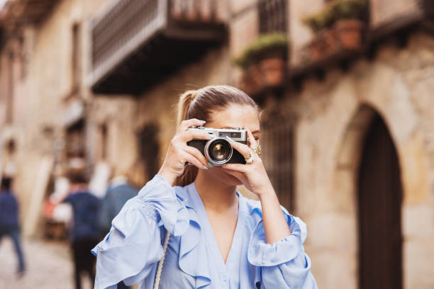 istock Young woman tsaking a picture 1148033296