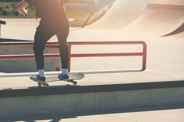istock skateboarding - skater boy doing trick at skatepark 1148035557