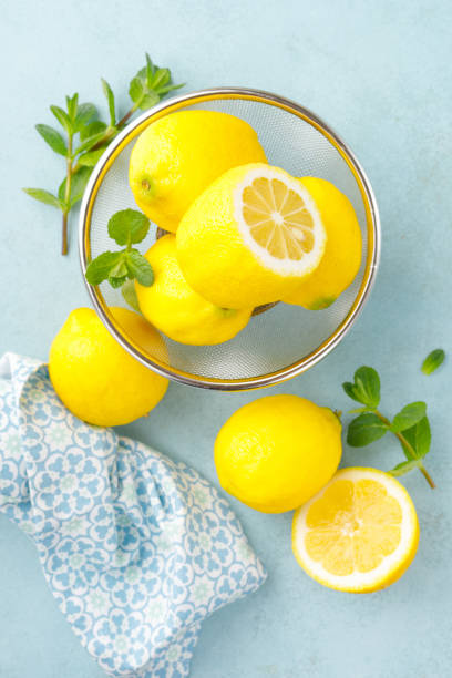 istock Sliced and whole lemons with mint 1148035760