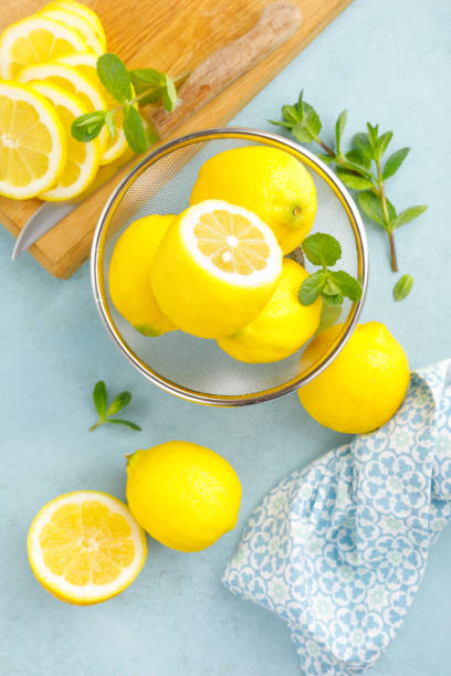 istock Sliced and whole lemons with mint 1148035881