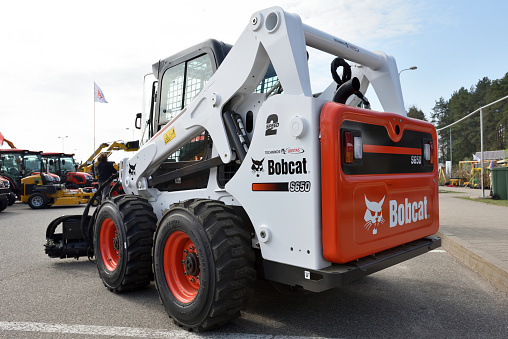 Vilnius, Lithuania - April 25: Bobcat heavy duty equipment vehicle and logo on April 25, 2019 in Vilnius Lithuania. Bobcat Company is an American-based manufacturer of farm and construction equipment.