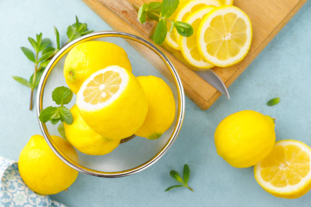 istock Sliced and whole lemons with mint 1148036550