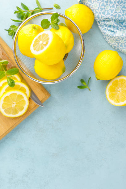 istock Sliced and whole lemons with mint 1148037154