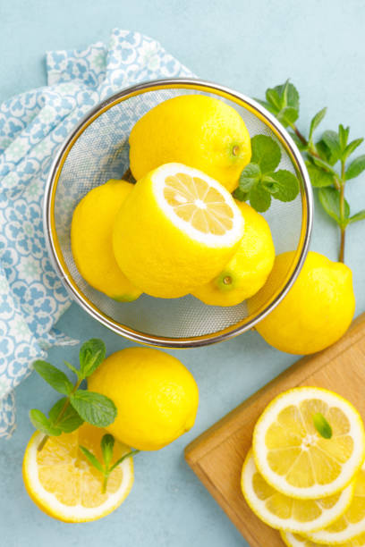 istock Sliced and whole lemons with mint 1148038899