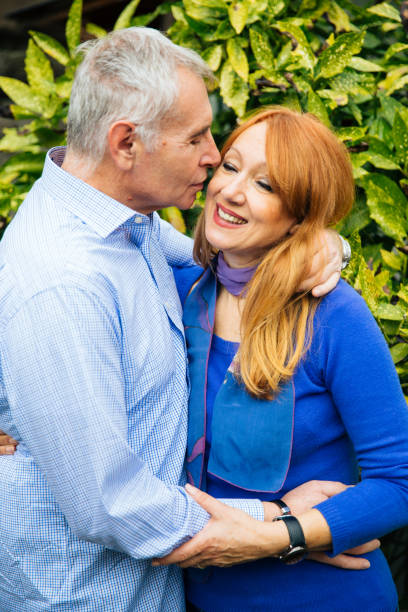 istock Modern mid aged couple enjoying the romance 1148040494