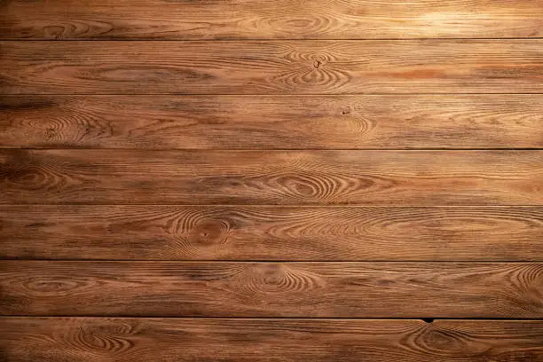 Photo of The texture of the wooden background of the boards