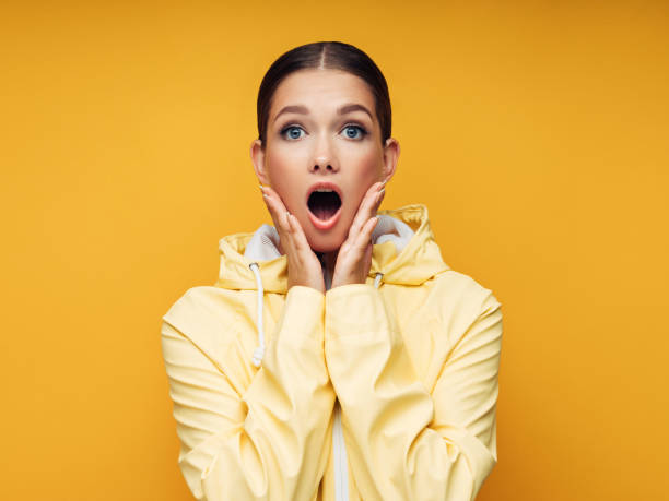istock Young Woman wearing raincoat 1148043854