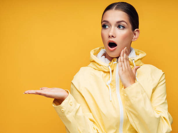 istock Young Woman wearing raincoat 1148043925