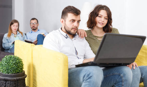 istock Young people with laptop and book 1148044503